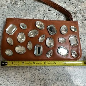 DKNY saddle color wristlet with rhinestones